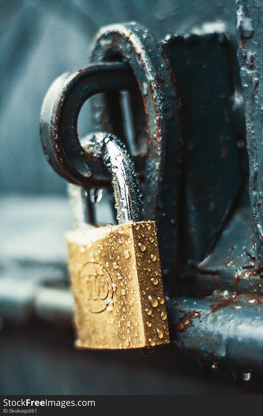 Close-Up Photography of Wet Padlock