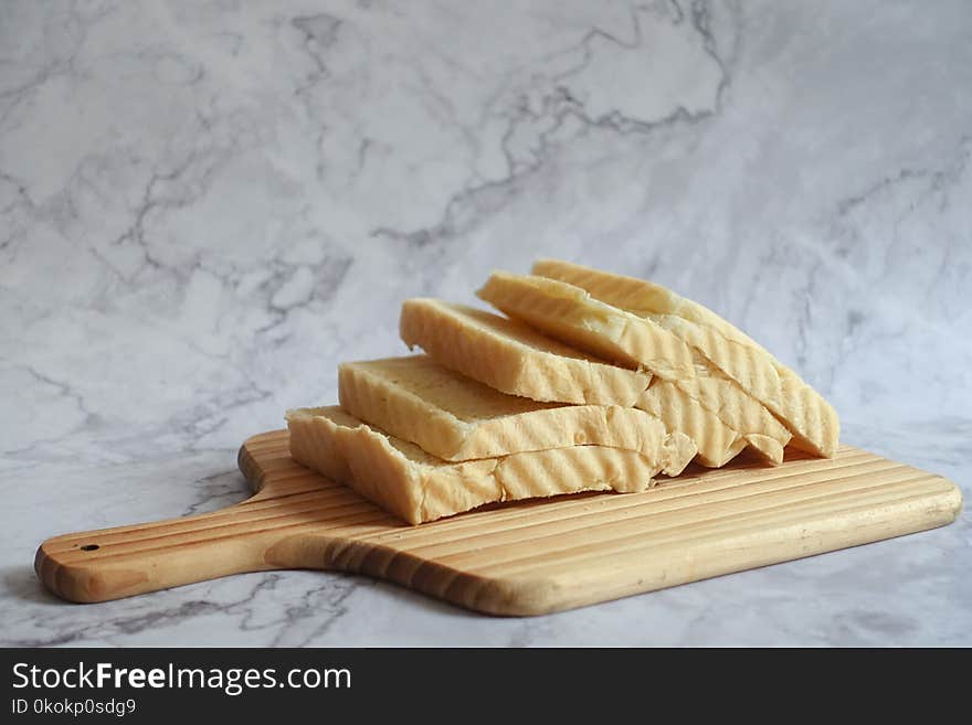 Slice Bread on Brown Chopping Board