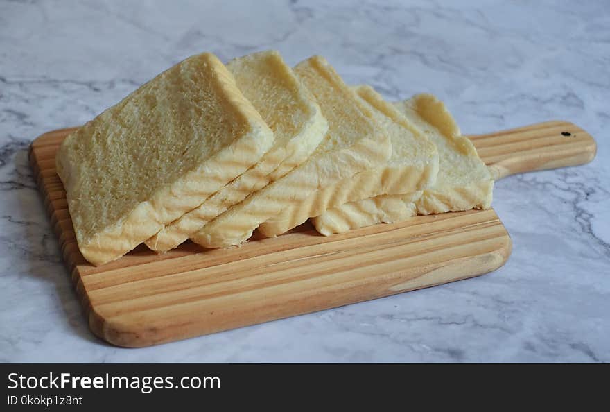 Photography of Sliced Bread on Chopping Board