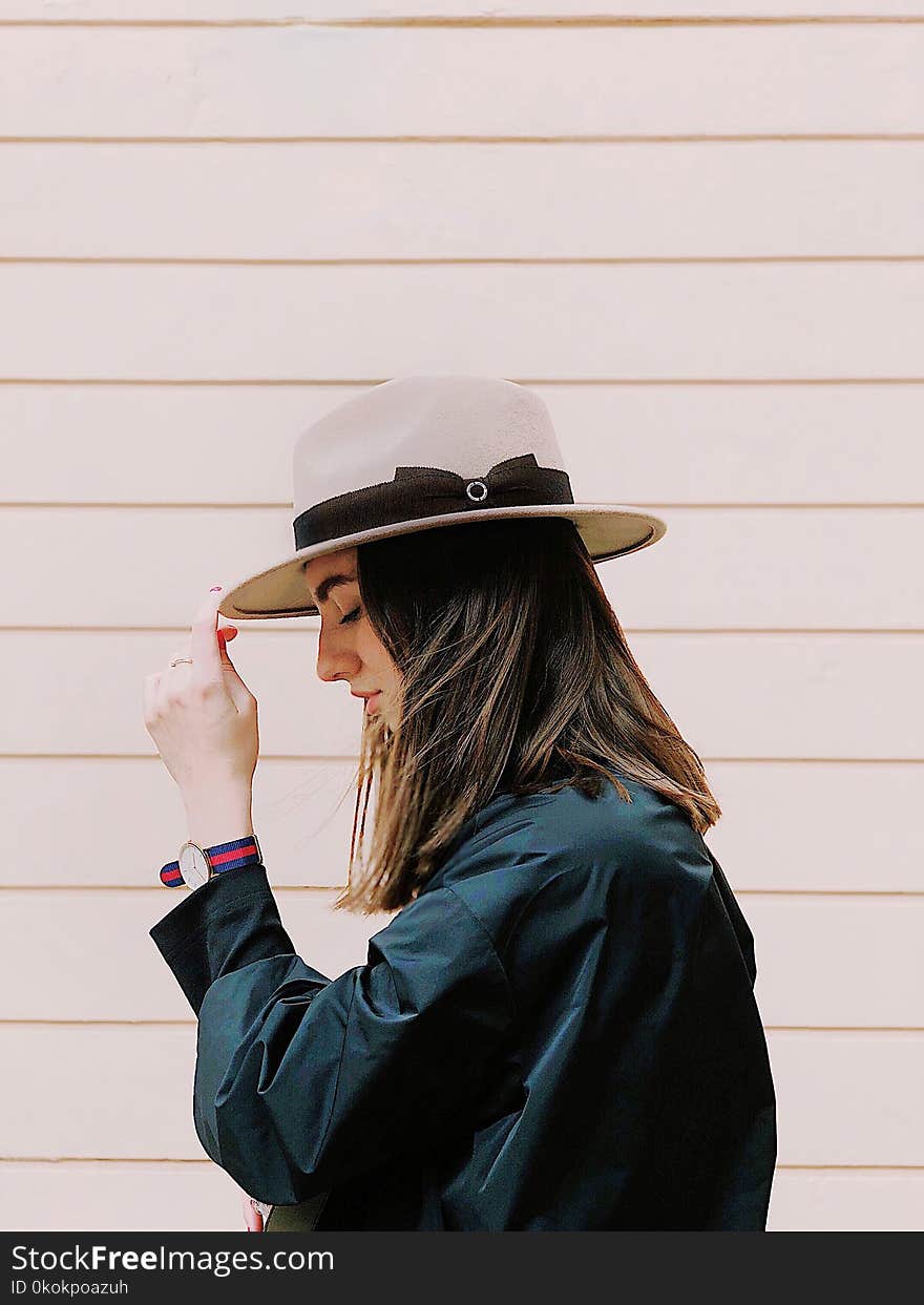 Side View Photography of a Woman Wearing Fedora