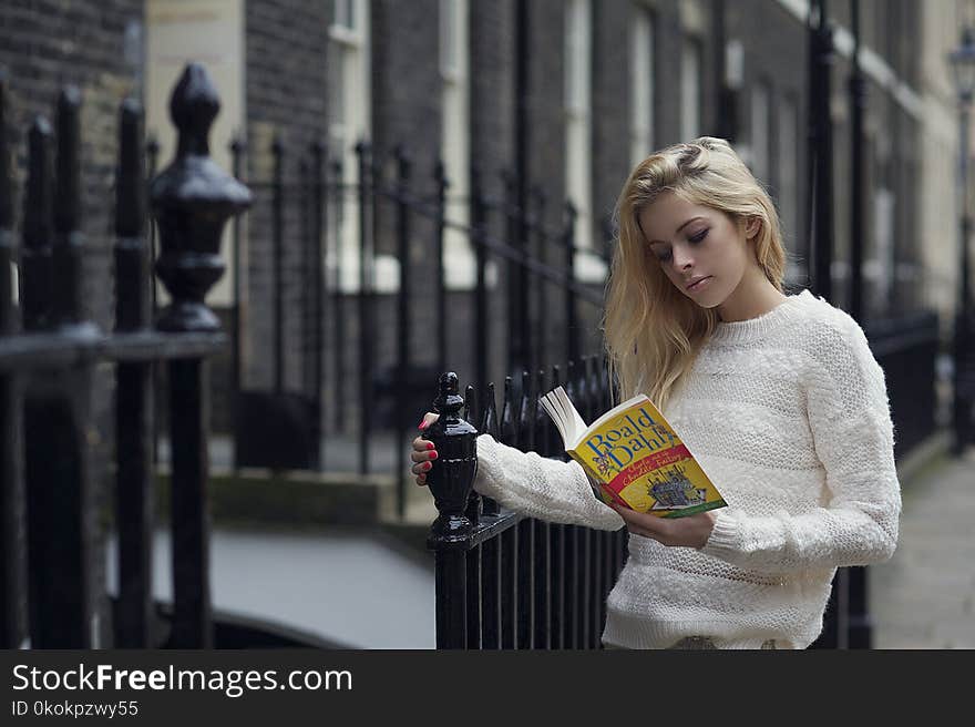 Woman Reading Boald Dahla Book