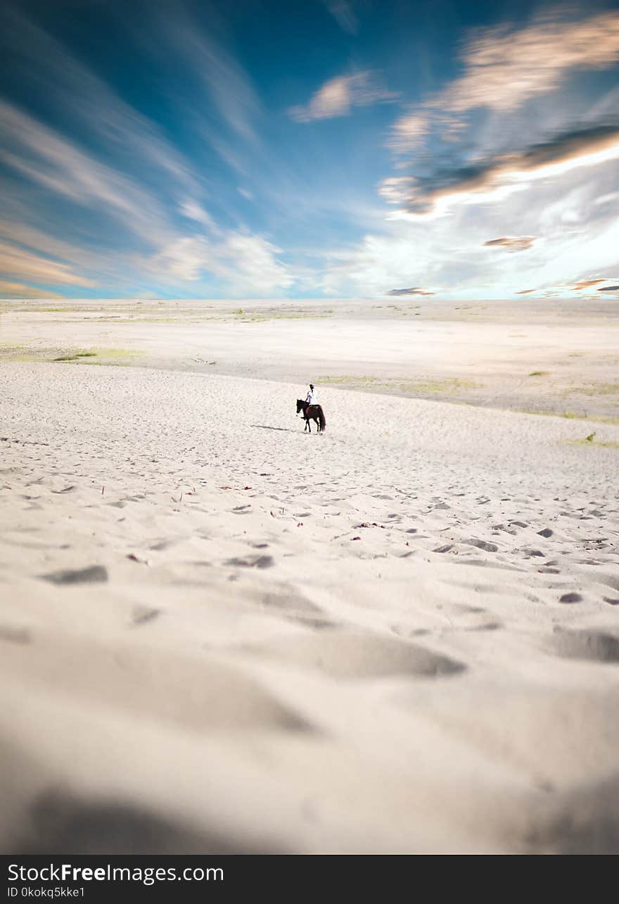 Man Riding Horse