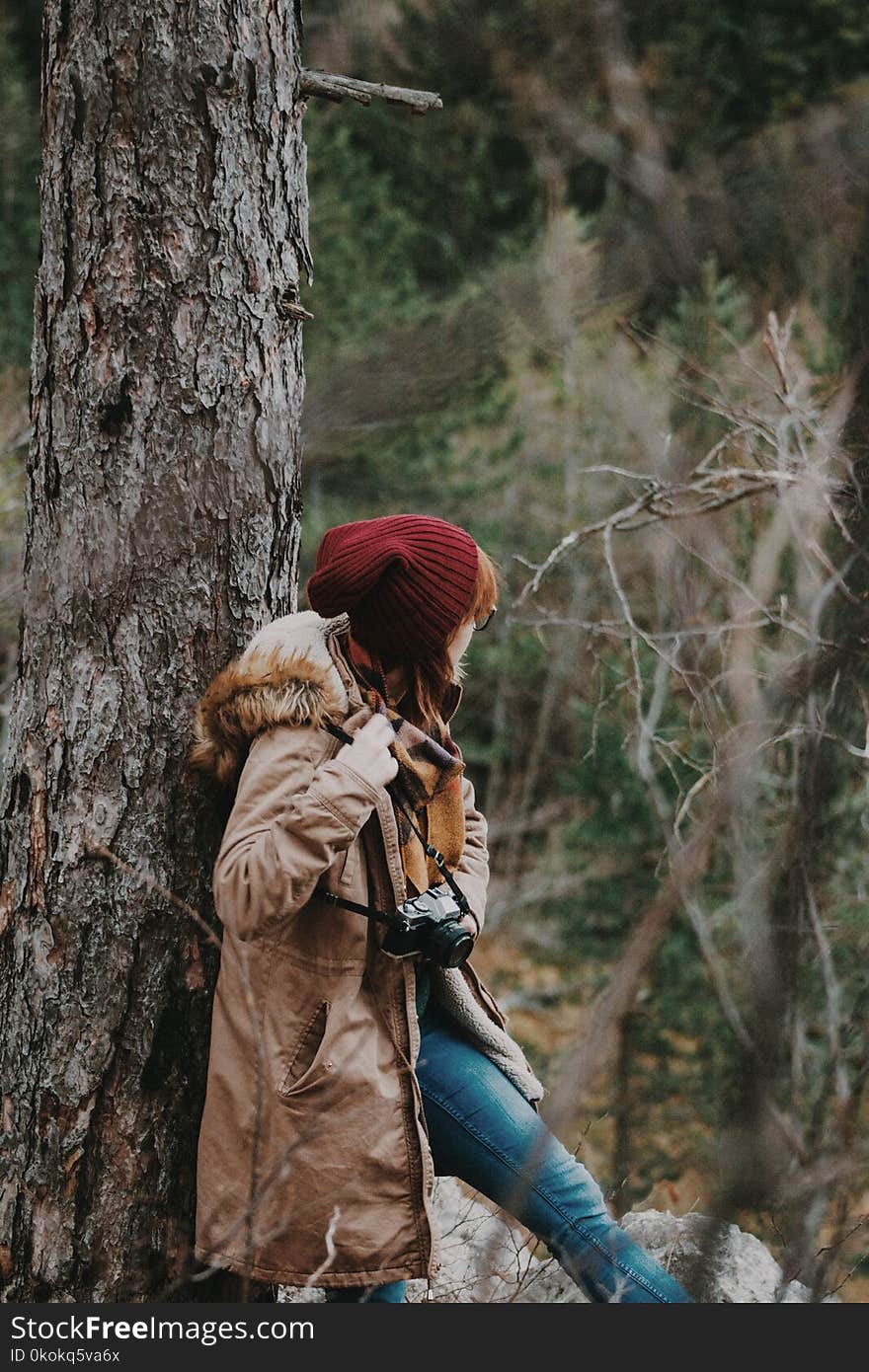 Woman Wearing Maroon Knitted Hat