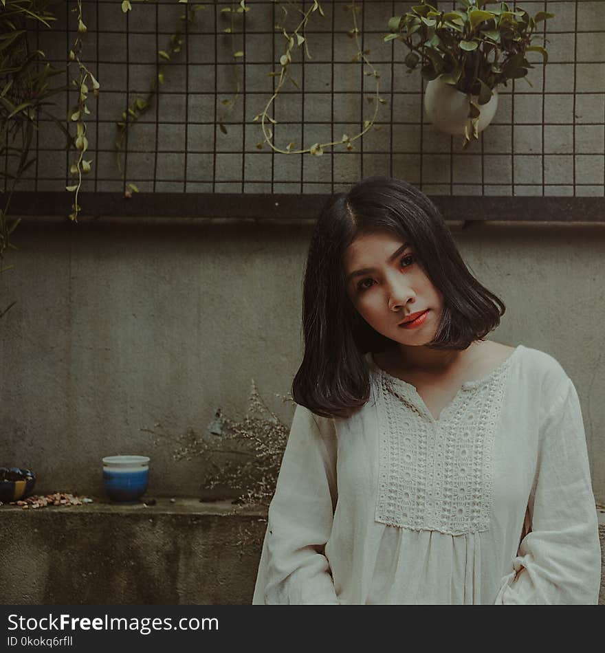 Photography of a Woman Looking at Camera