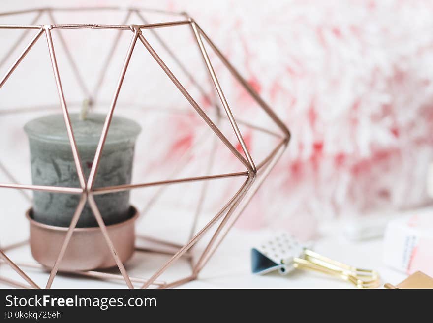 Selective Focus Photography Of Candle In Pink Ornate Holder