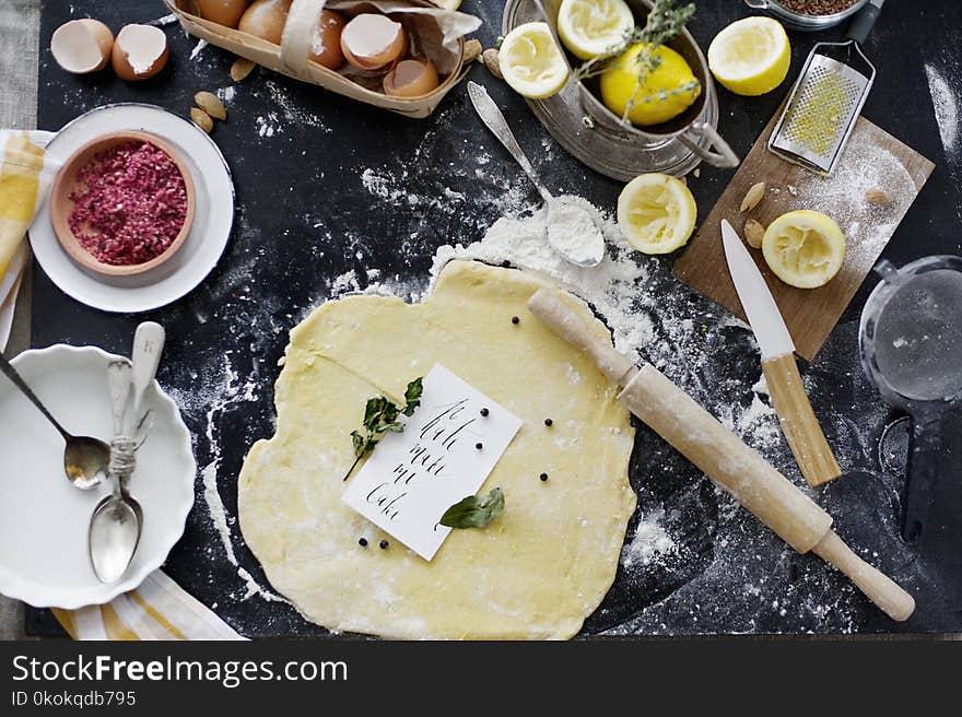 Dough and Flour Near Lemons and Rolling Pin