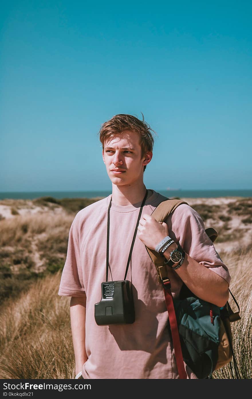 Photography of a Man Carrying Bag