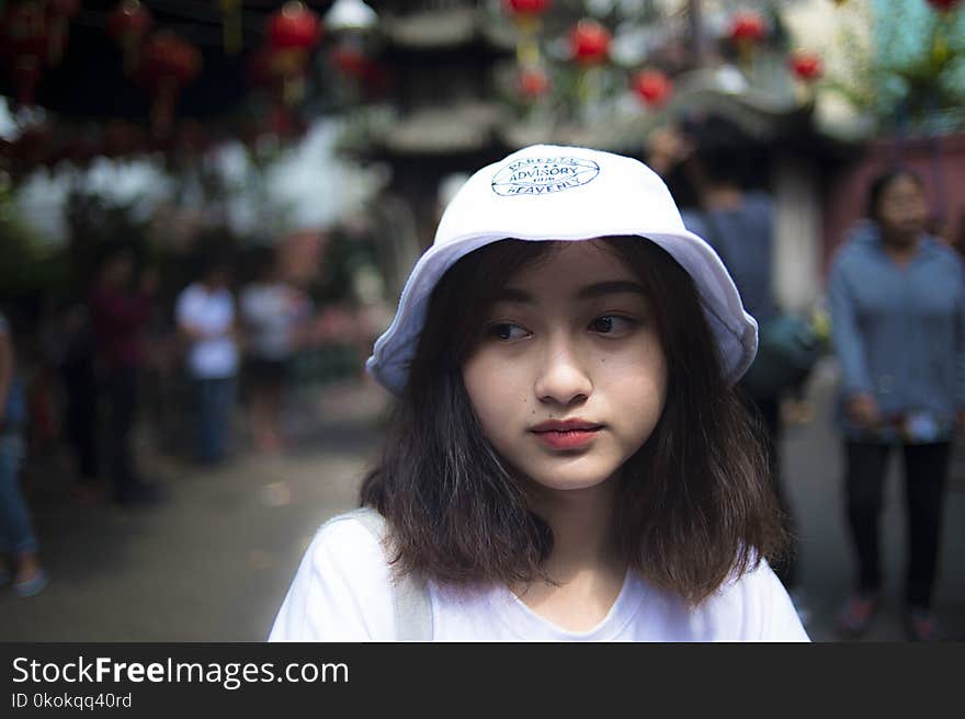 Woman Wearing White Bucket Cap