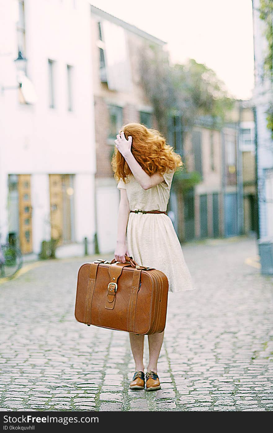 Woman In White Short-sleeved Dress Holding Brown Leather Suitcase