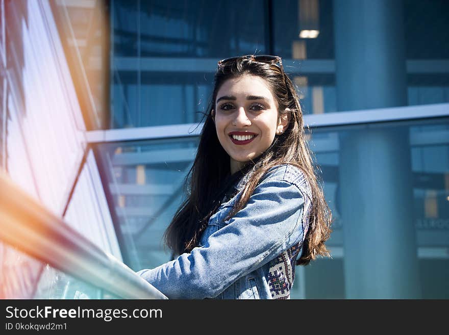 Woman In Blue Denim Jacket