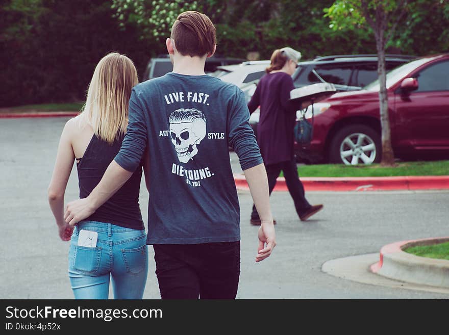 Man Wearing Gray Long-sleeved Shirt With Woman Wearing Black Camisole Top