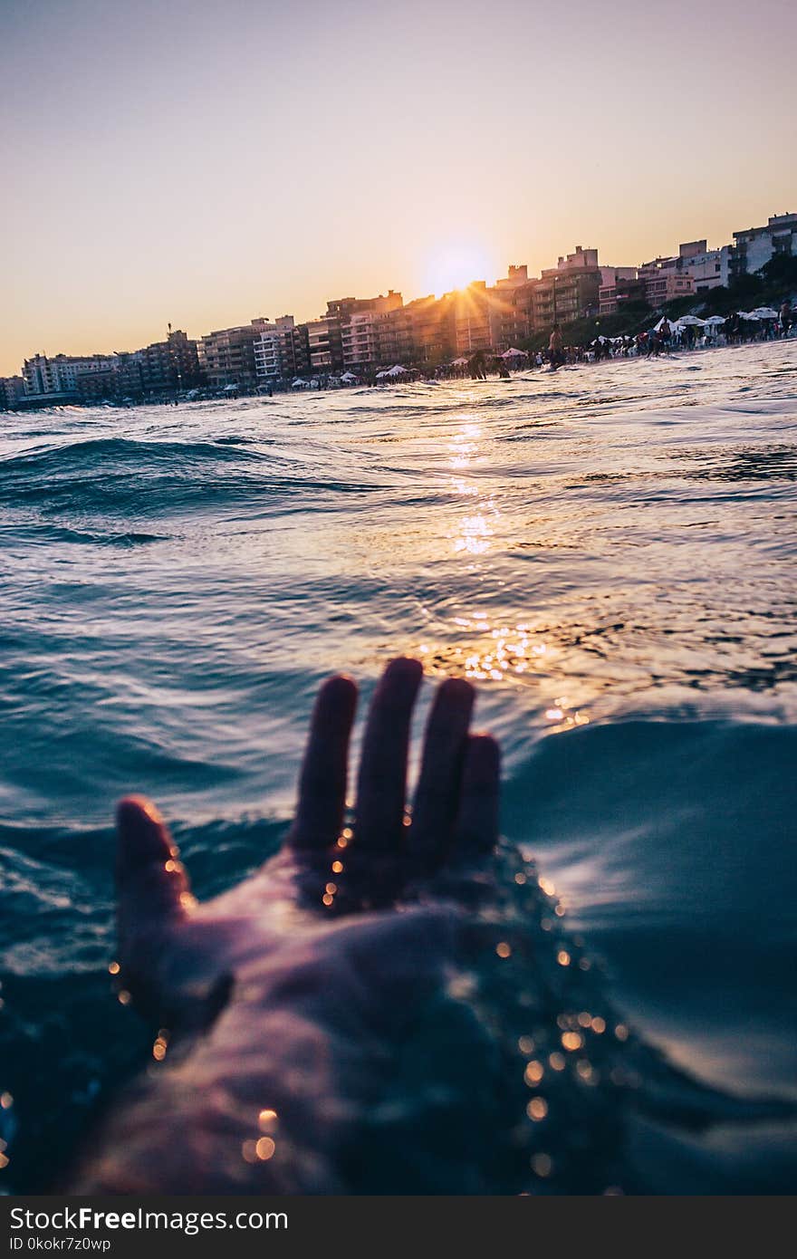 Person Soaking At The Beach