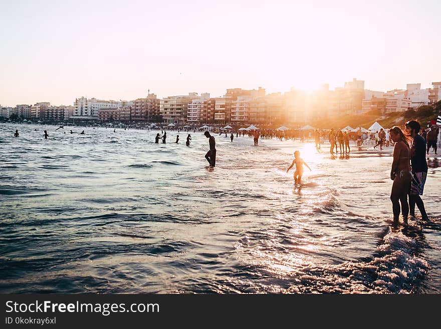 People At The Beach During Golden Hour