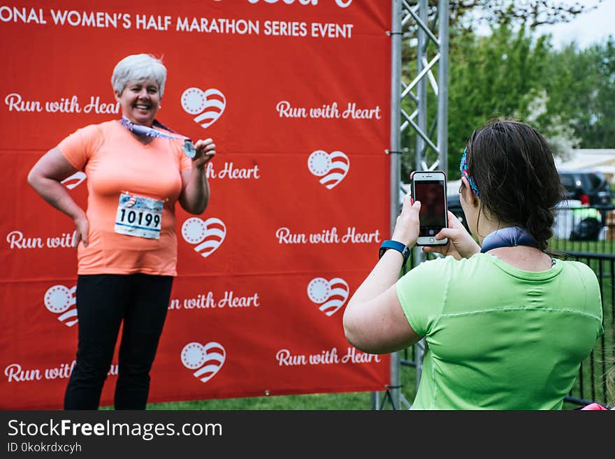 Woman On Stage Wearing Medal