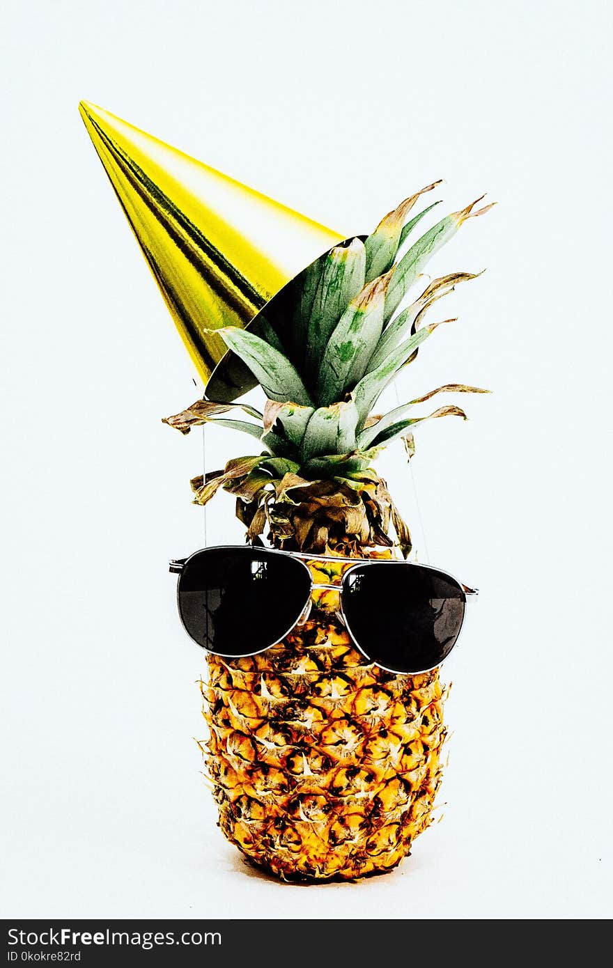 Photo Of Pineapple Wearing Black Aviator Style Sunglasses And Party Hat