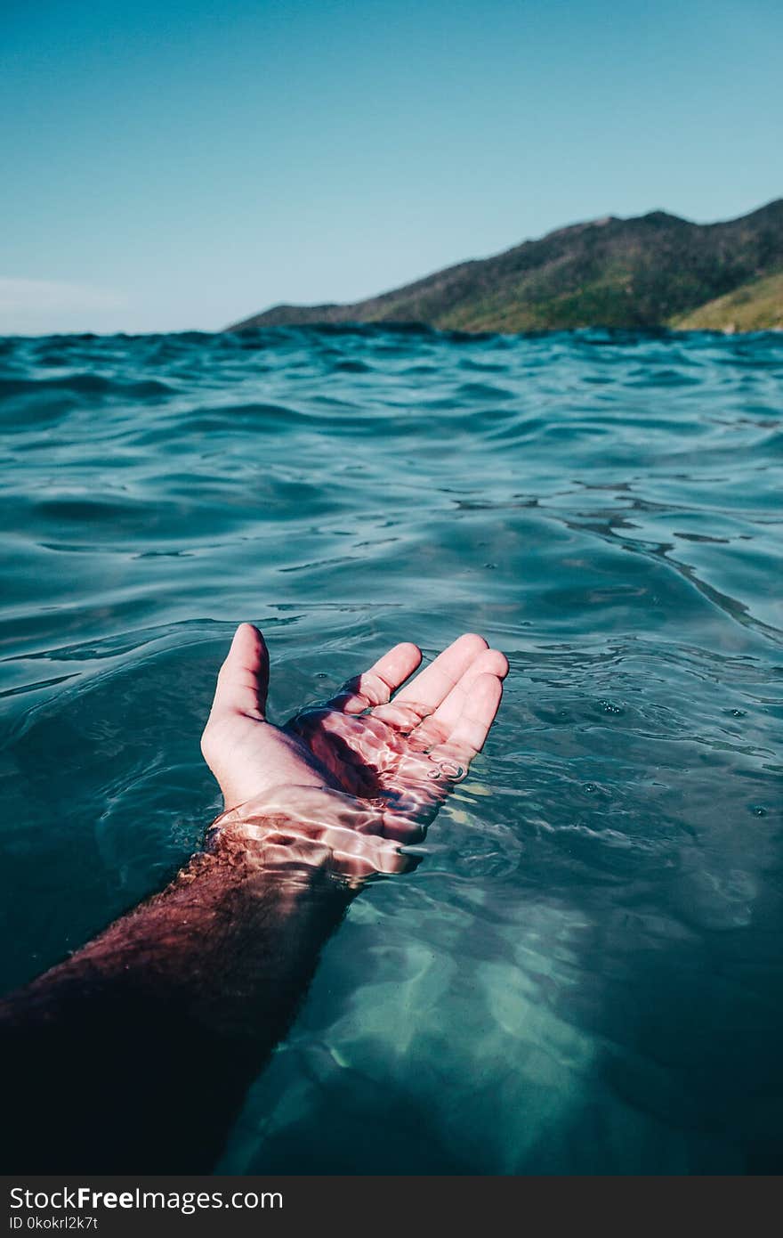 Person Soaking On Body Of Water