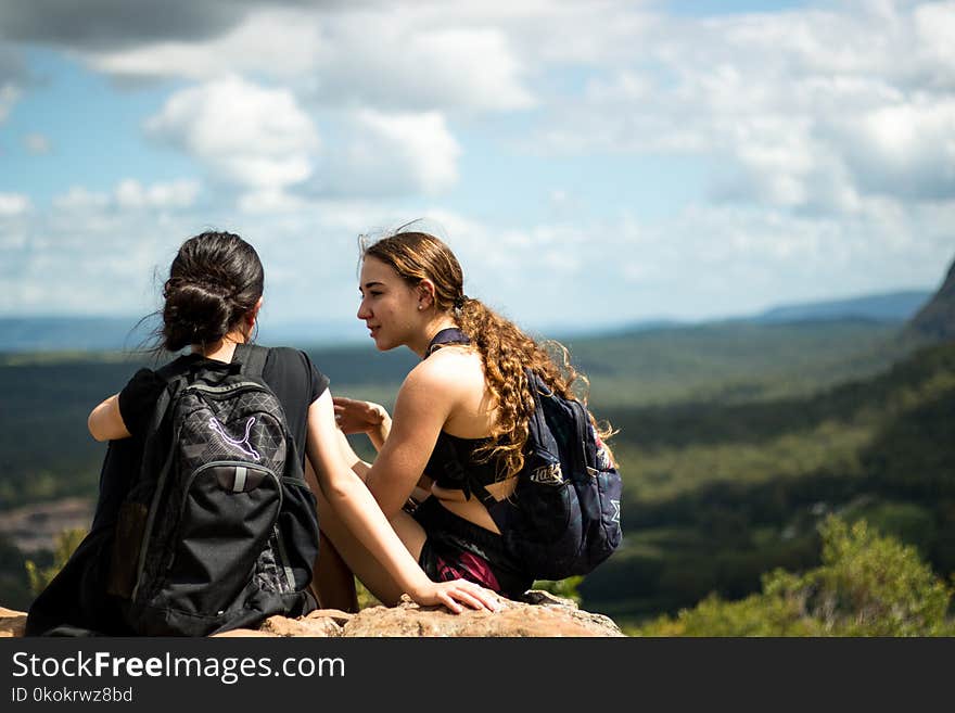 Two Woman Sitting