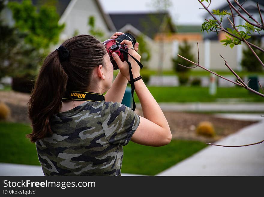 Woman Wearing Camouflage Scoop-neck Shirt