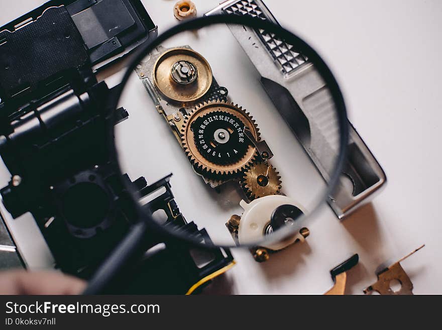 Shallow Focus Photography of Magnifying Glass With Black Frame