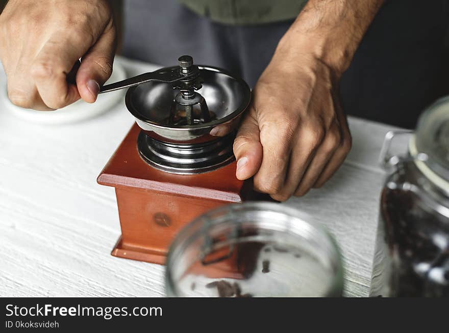 Person Holds Brown And Black Hand Tool