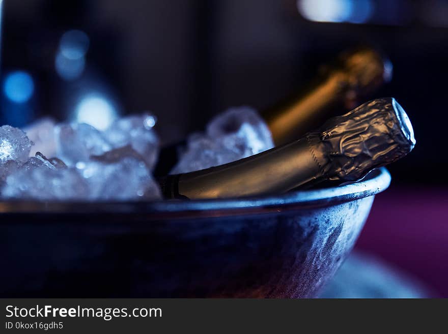 Bottles of expensive champagne on frape with ice. details