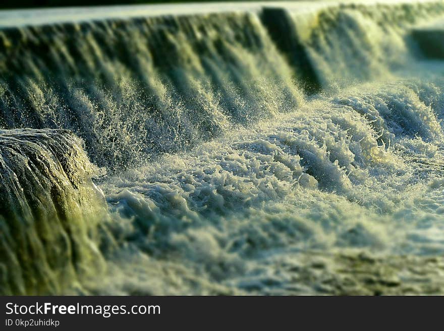 This is an image of flowing foamy water with sprinkling of water drops... The image has combination of both sharpness and blur... The image can also be used as a natural aqua or environment background. This is an image of flowing foamy water with sprinkling of water drops... The image has combination of both sharpness and blur... The image can also be used as a natural aqua or environment background...