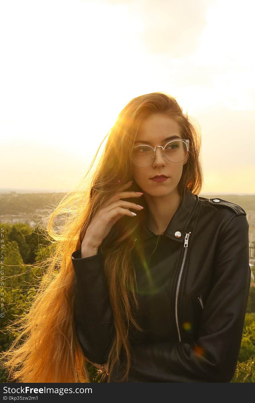 Woman Wearing Black Leather Bikers Jacket and Sunglasses