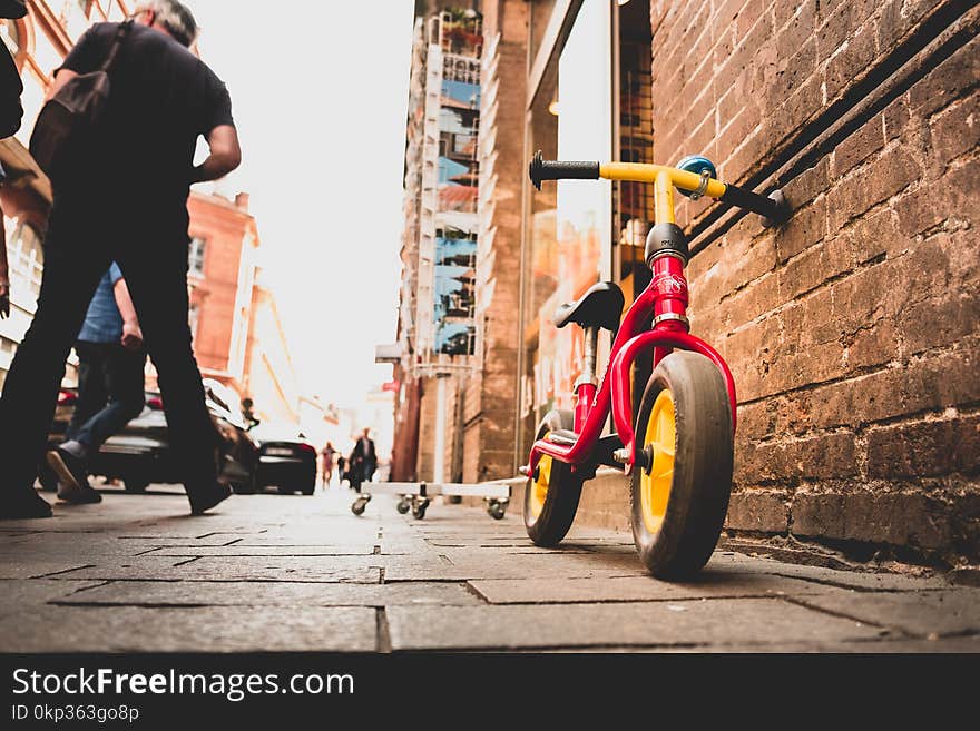 Bicycle Leaning on Brick Wall