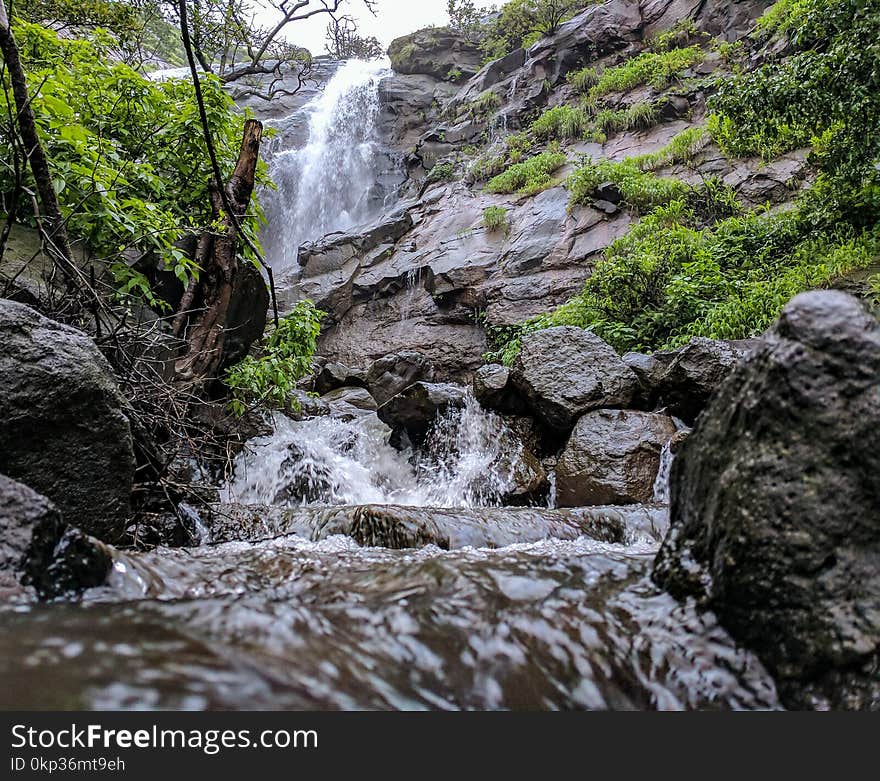 Timelapse Photography of Waterfalls Under Cumulus Nimbus Clouds