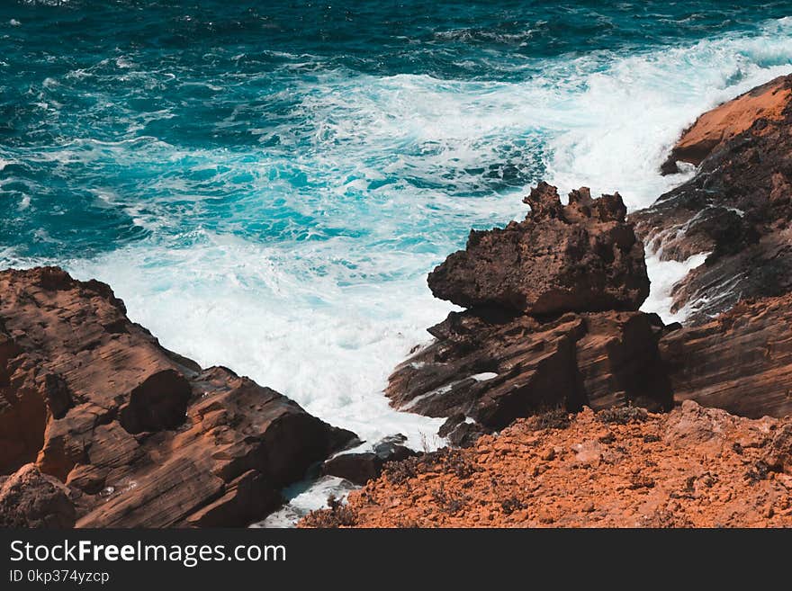 Photo of Rocks Formation on Seashore