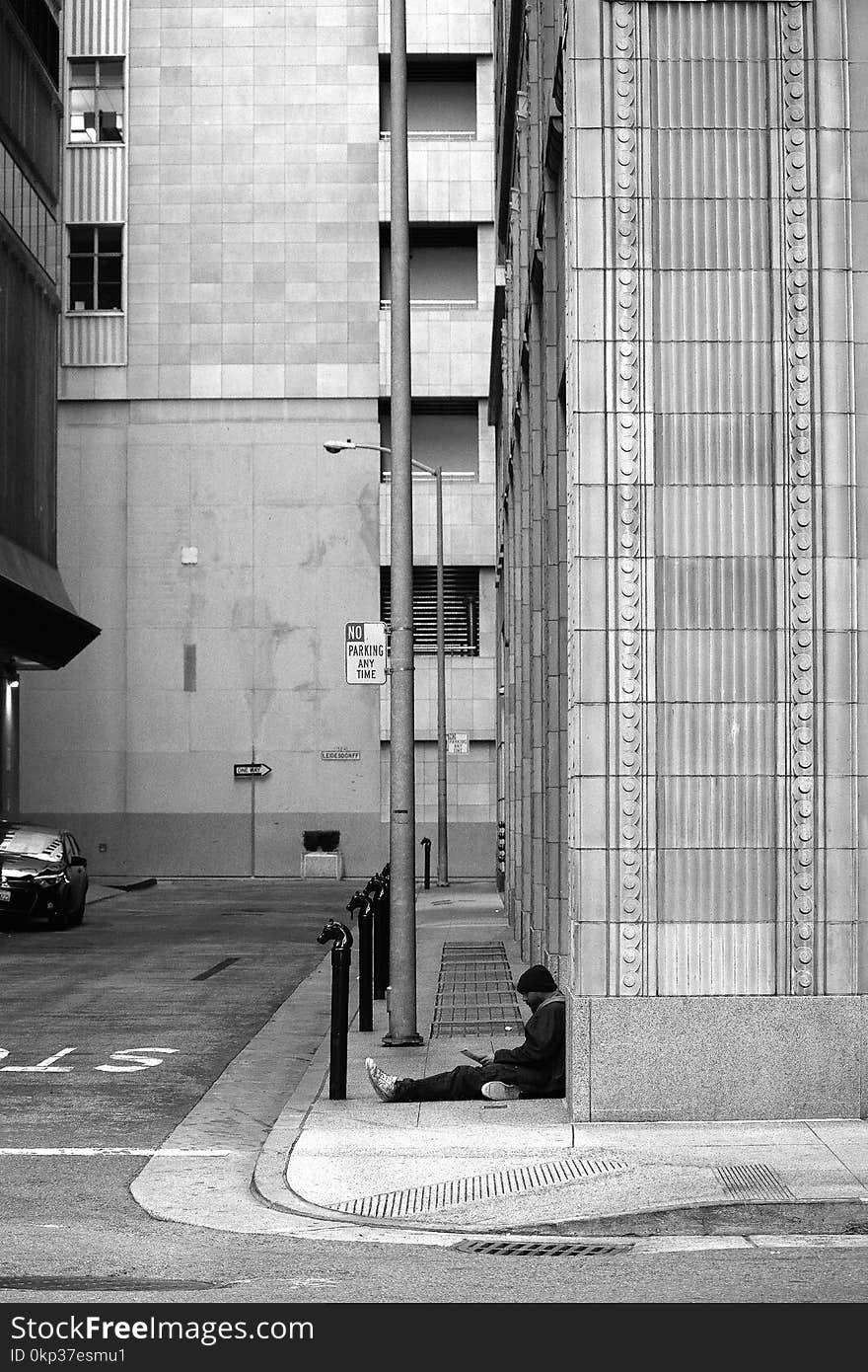 Grayscale Photography of Man on Pavement