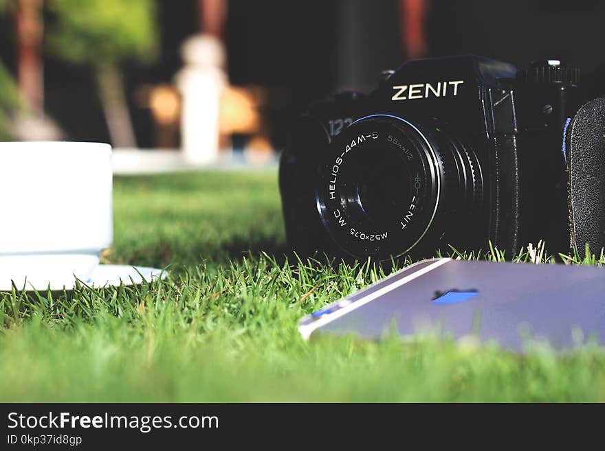 Black Zenit Dslr Camera in Shallow Focus Photography