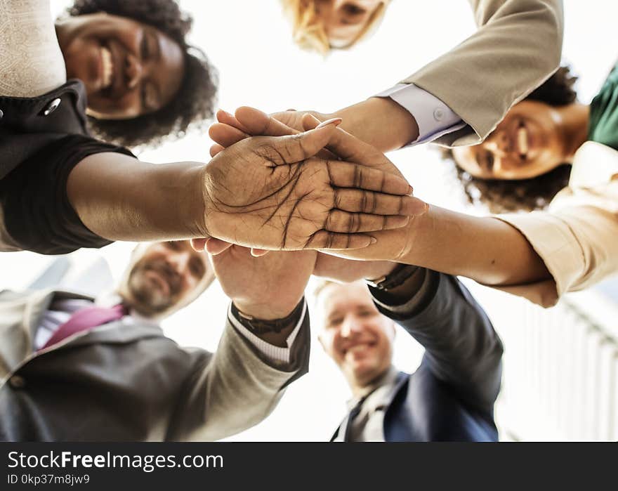 Photography of People Stacking Hands Together