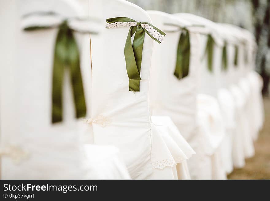 Selective Focus Photography of White Padded Chair