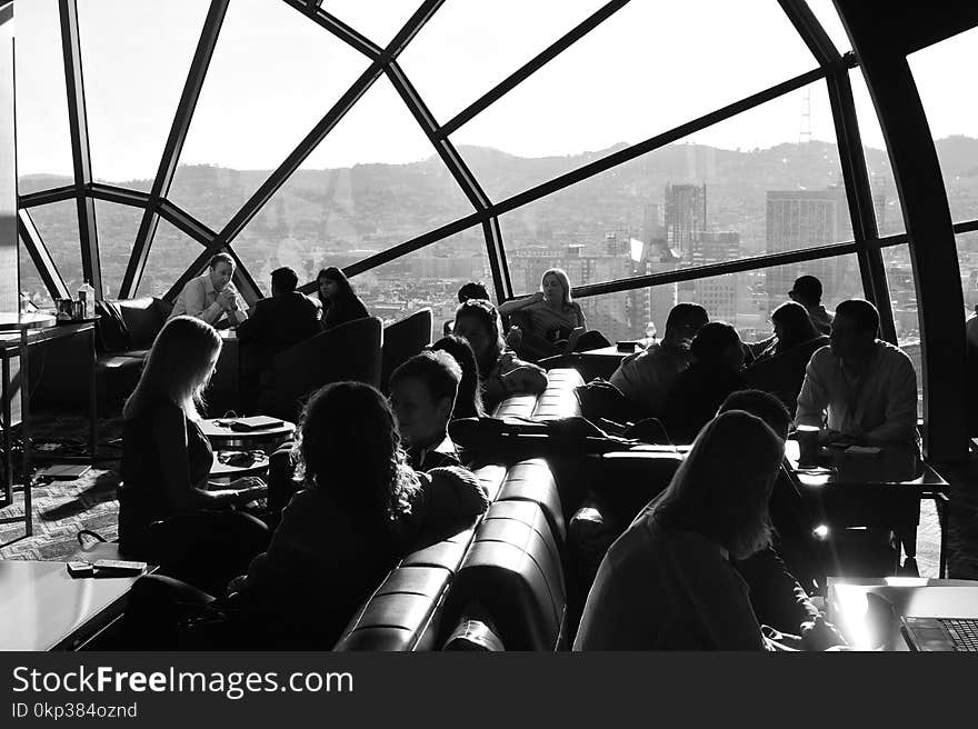 Grayscale Photo Of People At Restaurant