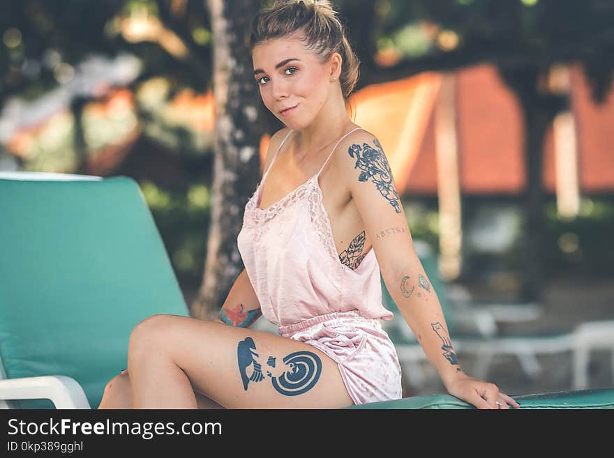 Woman Wearing Pink Spaghetti-strap Rompers