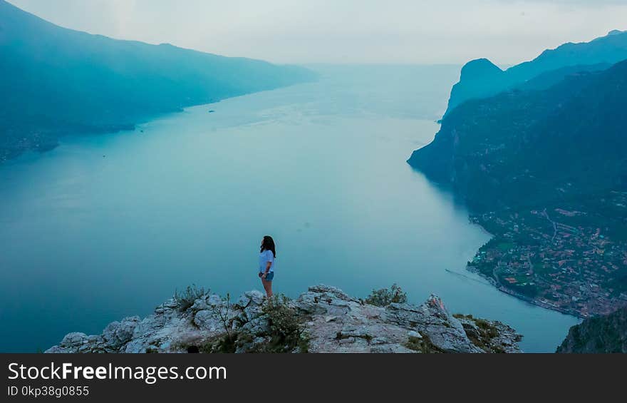 Woman Standing on Mountain during Dayttime