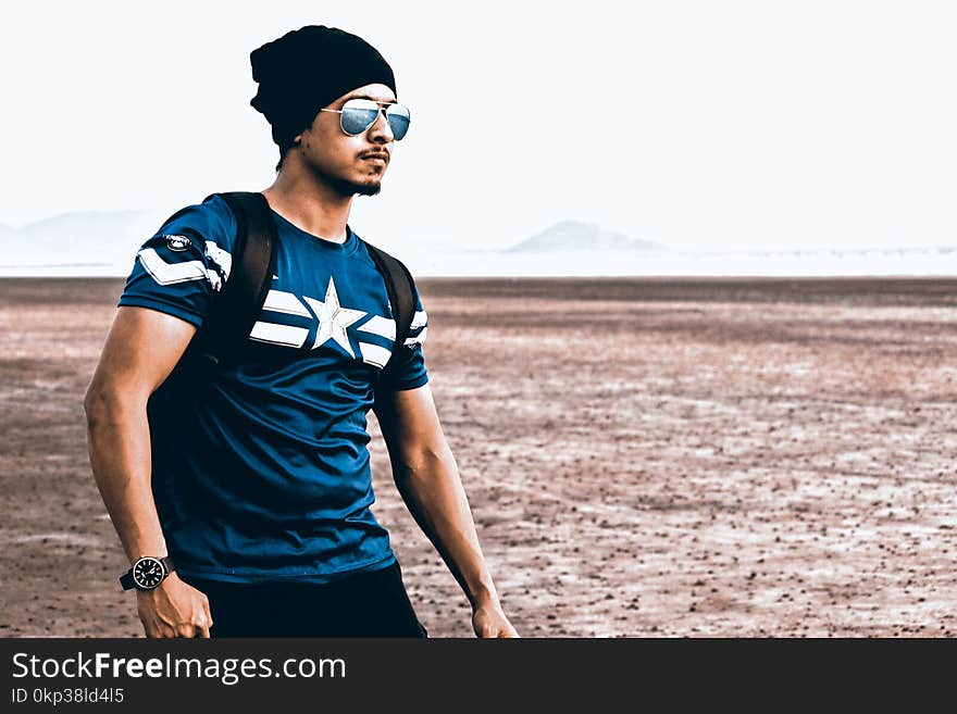 Photography of a Guy Wearing Bonnet and Sunglasses