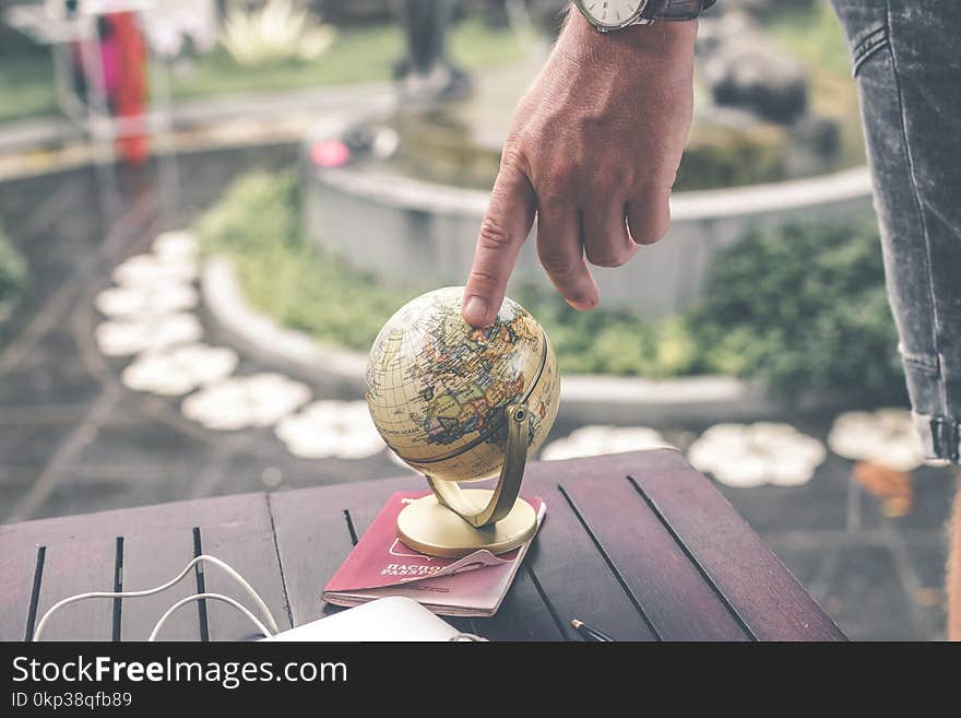 Person Holding Terrestrial Globe Scale Model Taken