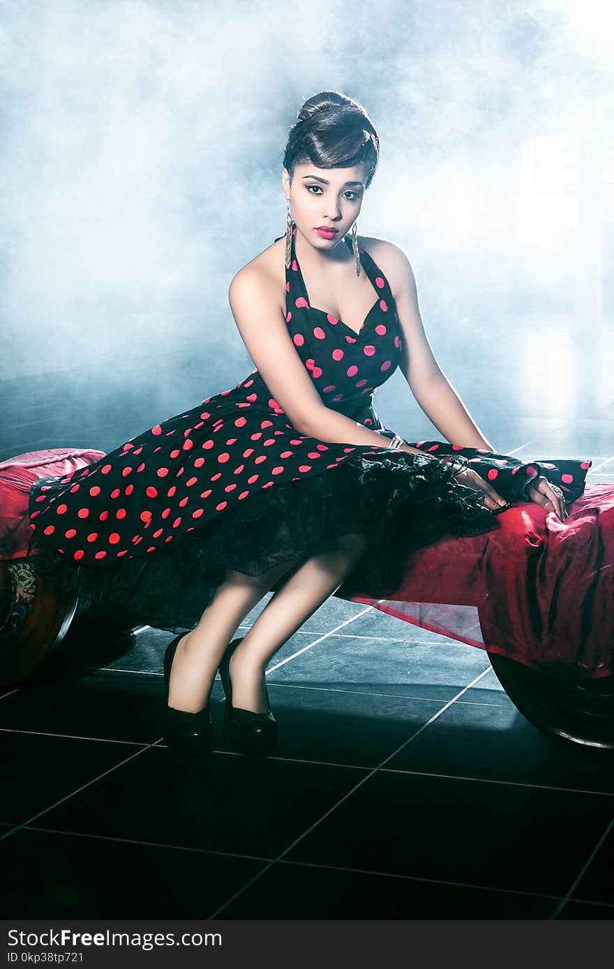 Woman Wearing Black and Red Polka-dot Dress