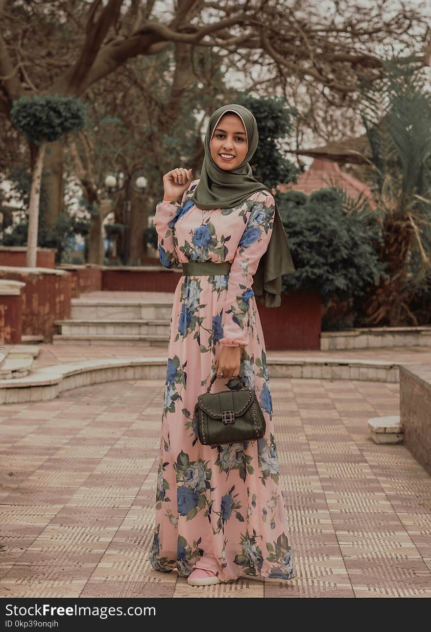 Woman Wearing Pink and Blue Floral Dress