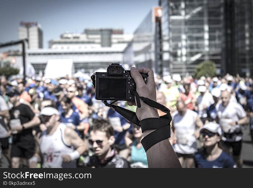 Person Hoding Camera Taking Photo of People