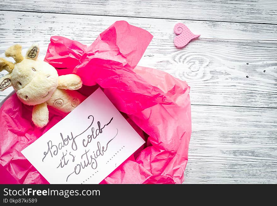 Birth of girl - baby shower concept on wooden background top view