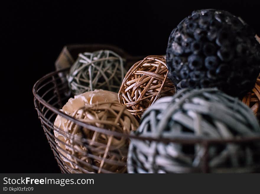 Brown and Gray Vine Balls on Brown Metal Rack