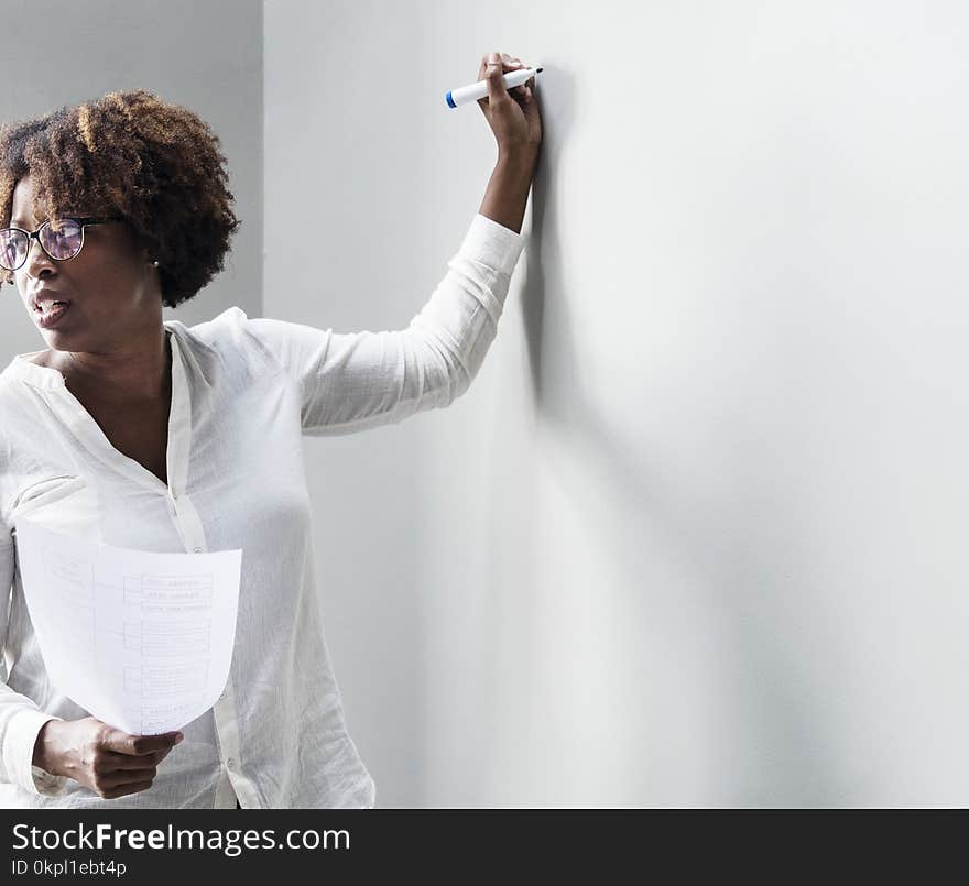 Woman In White Dress Shirt Holding Blue Permanent Marker