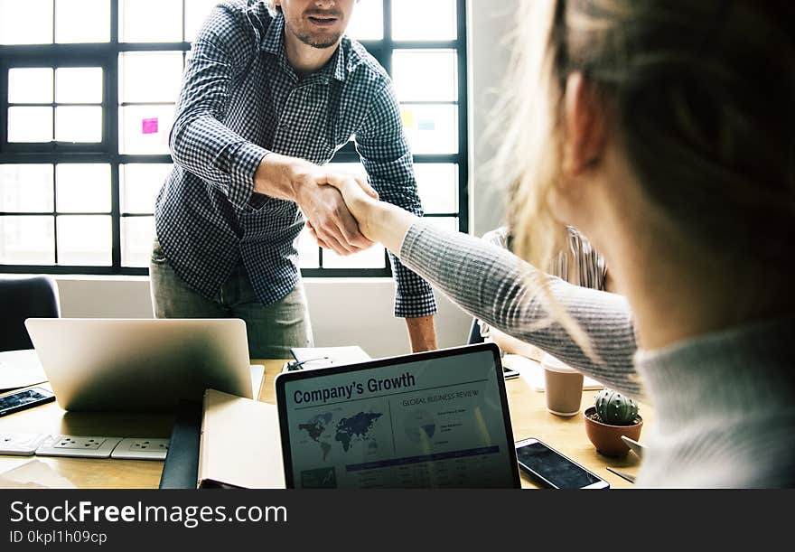 Man Shaking Hands With Woman