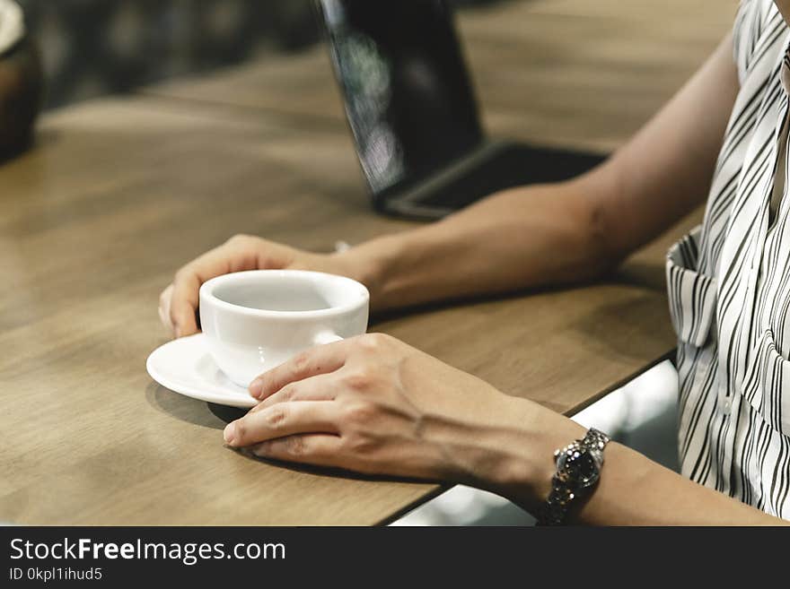 Person Holding Teacup