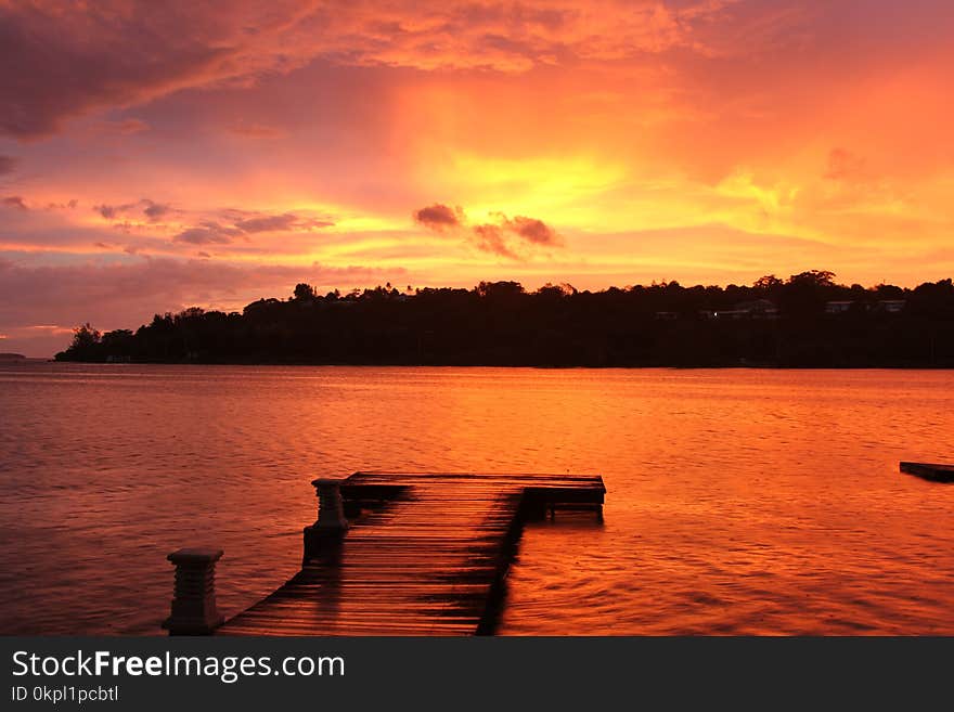 Silhouette Photo of Island at Golden Hour