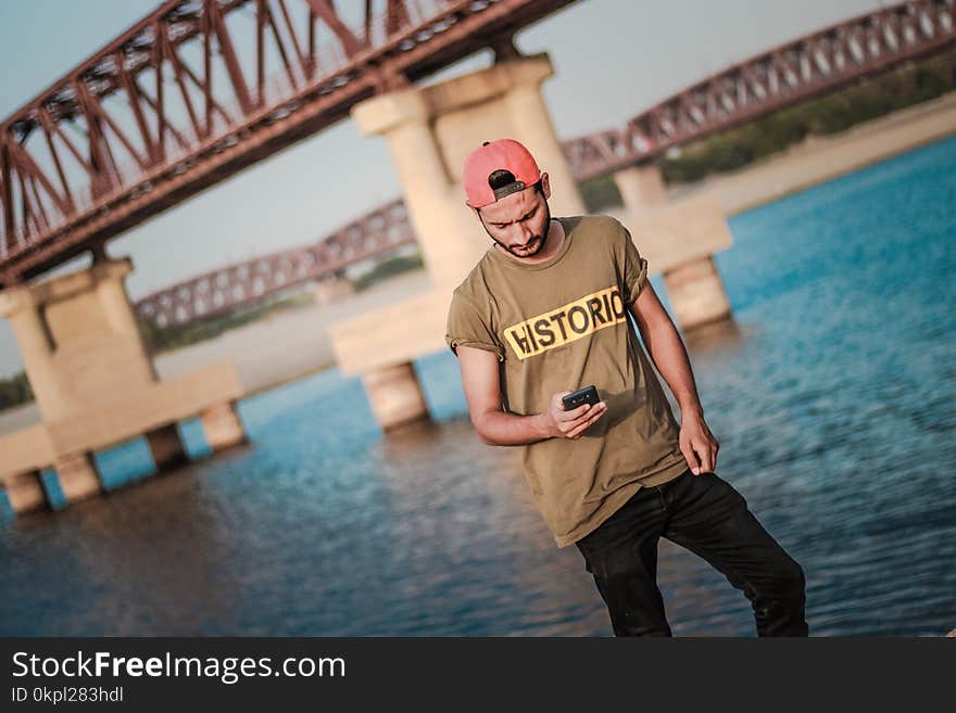 Man Holding a Mobile Phone