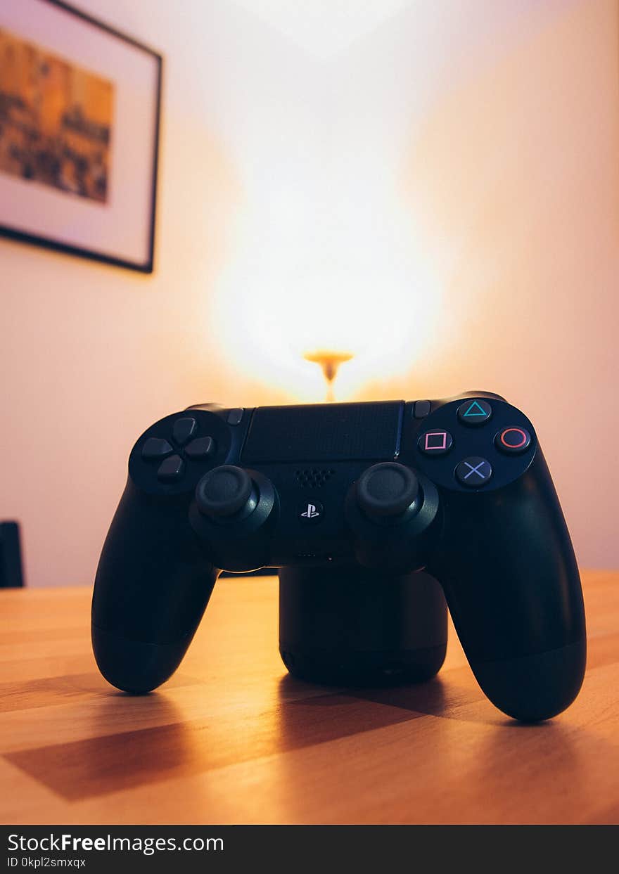 Black Sony Ps4 Dualshock 4 On Tabletop